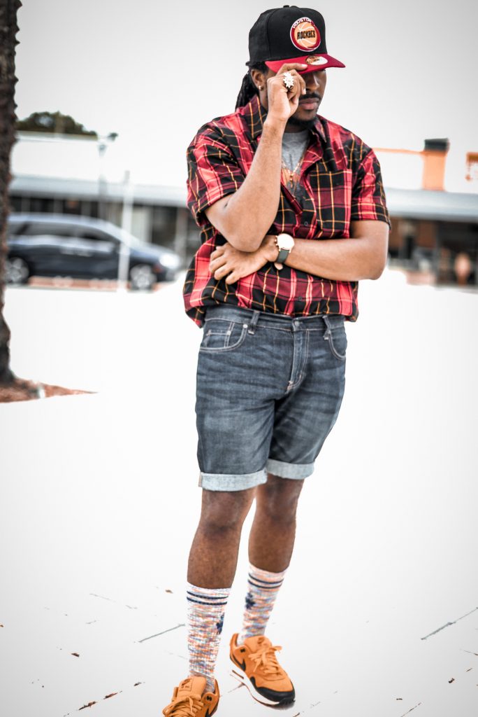 grey t shirt tucked into navy denim shorts, red button up layered over and tucked in, yellow and red socks, yellow and red air max 1, houston rockets old school baseball cap. How to style DIY denim shorts! 6 different outfits!