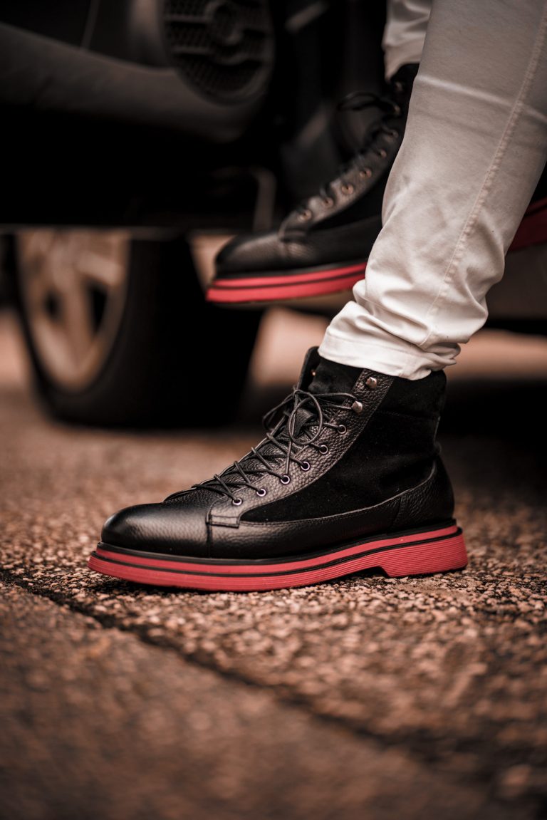 White pants, black and red boot